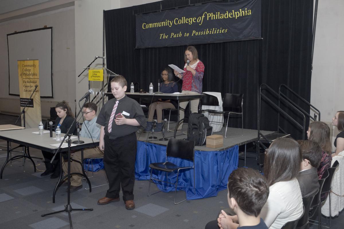 Middle school students participate in a mock Youth Court, a peer mediation created by attorney and advocate Edgar Cahn, who delivered a talk on social justice during Law and Society Week. Law & Society Week