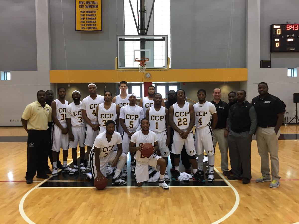 Men's Colonial Basketball Team 2014 Back Row, left to right: Assistant coach Terrell Wright, assistant coach Solomon Walker, Rafiq Johnson, Basir Fulmore, Ron Rollins, Mikal Mumin, Lennon Winebrenner, Dante Collier, Zachary Stone, Jaleel Williams, manager Fred Washington, Nigel Caldwell, Marcus Smith, head coach Joe Rome, manager Kyle Stanton, assistant coach Kenyatta McKinney, assistant coach Andre Wright. Front row,left to right: Devin Bowsky and Jeff Giddings. (Not Pictured: Jeff Williford and Eric Massenburg, Jr.)