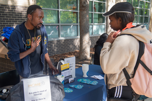 Students in WEALTH•NESS tabling a club fair