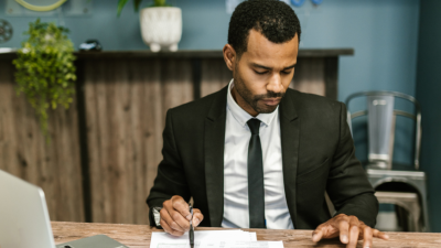 A busy accountant works at his desk
