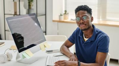 Person coding at their computer