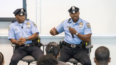 Two officers speaking to a class