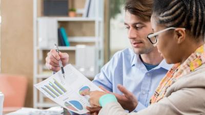 An accountant reviews financial information with her client