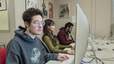 Student works at a computer screen