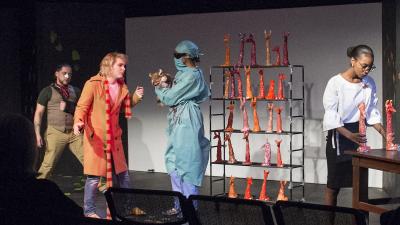 Actors on stage performing a play.