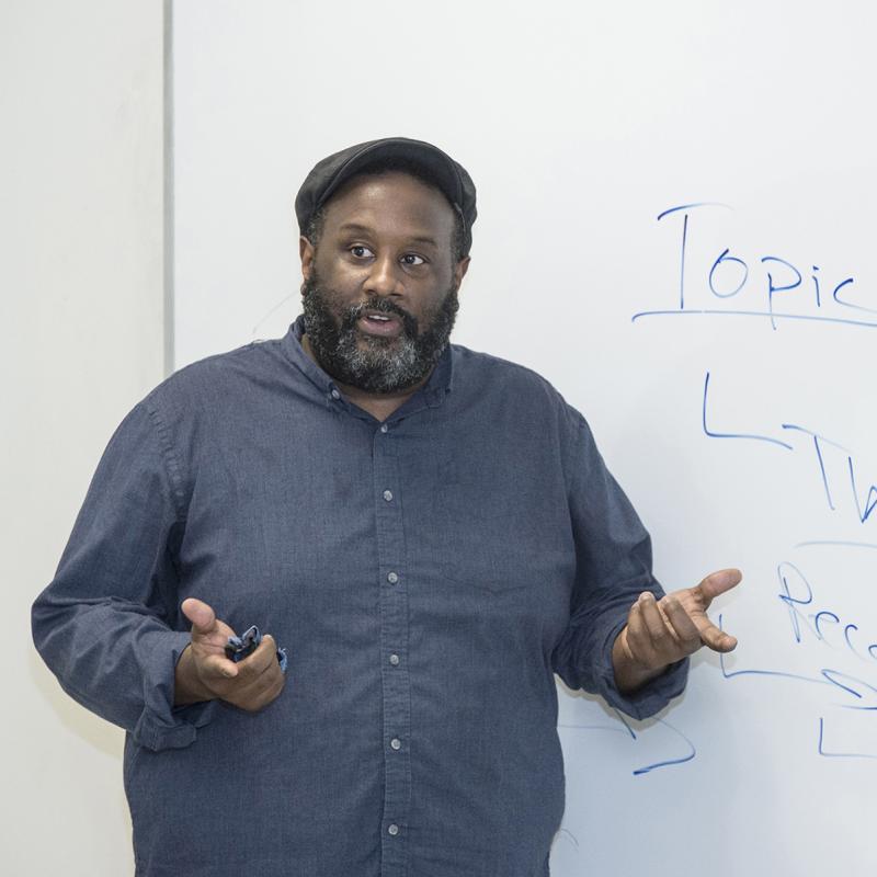 Instructor speaks to his students.
