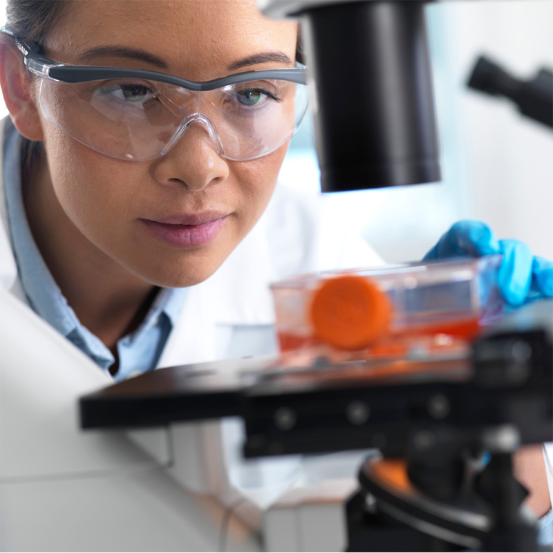 A biomedical technologist tests lab equipment