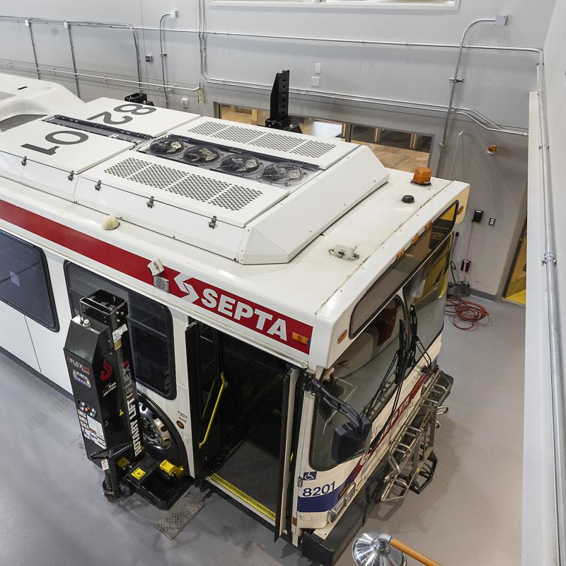 View of a bus in a garage from above.