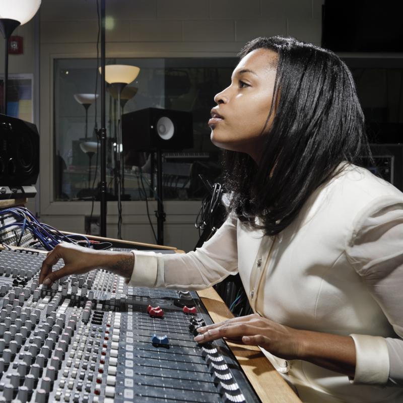 Woman works at soundboard