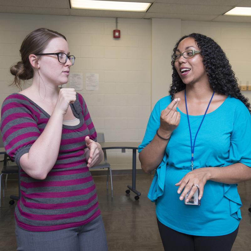A student and translator communicating via ASL