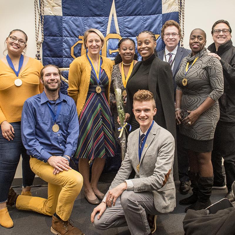 A group of students and staff advisors celebrate Phi Theta Kappa awardees