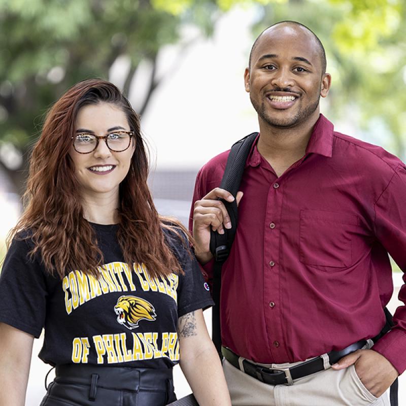 Two student SGA officers standing together on campus
