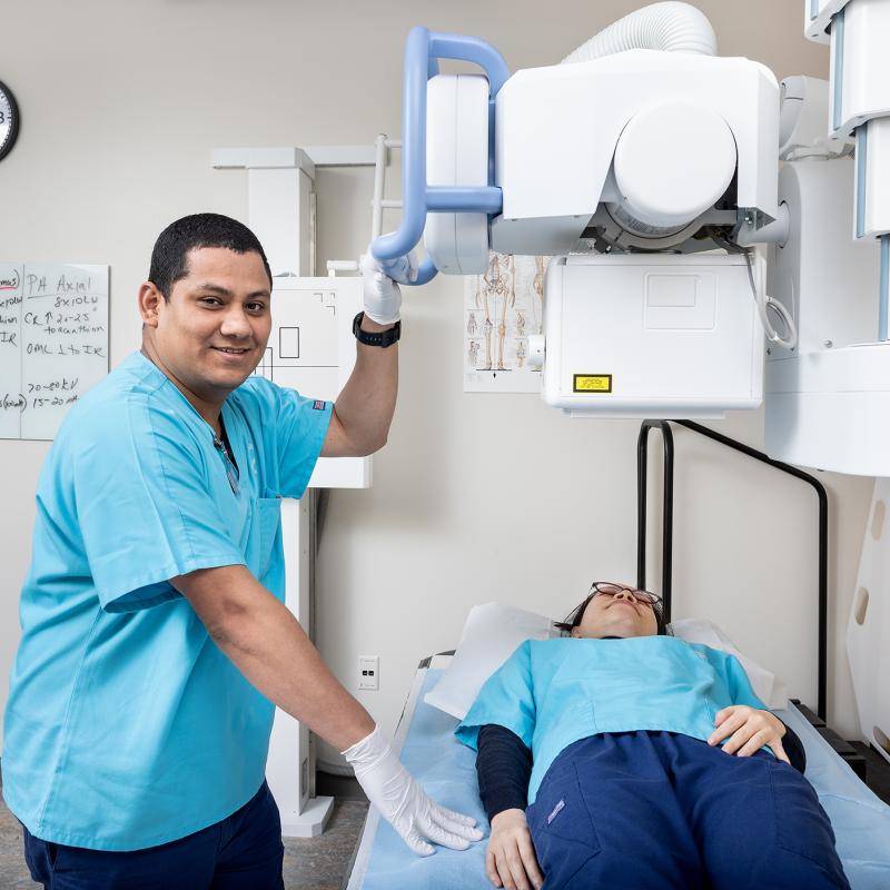 Students using a medical machine in class