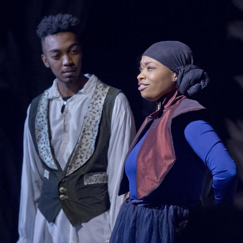 two students perform in character and costume