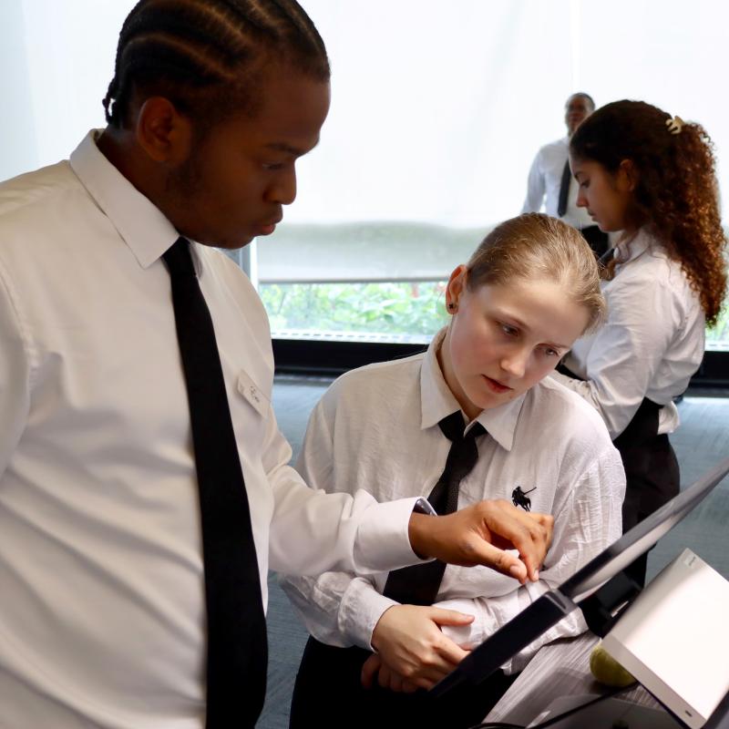 Tourism and Hospitality Students Observing a Menu