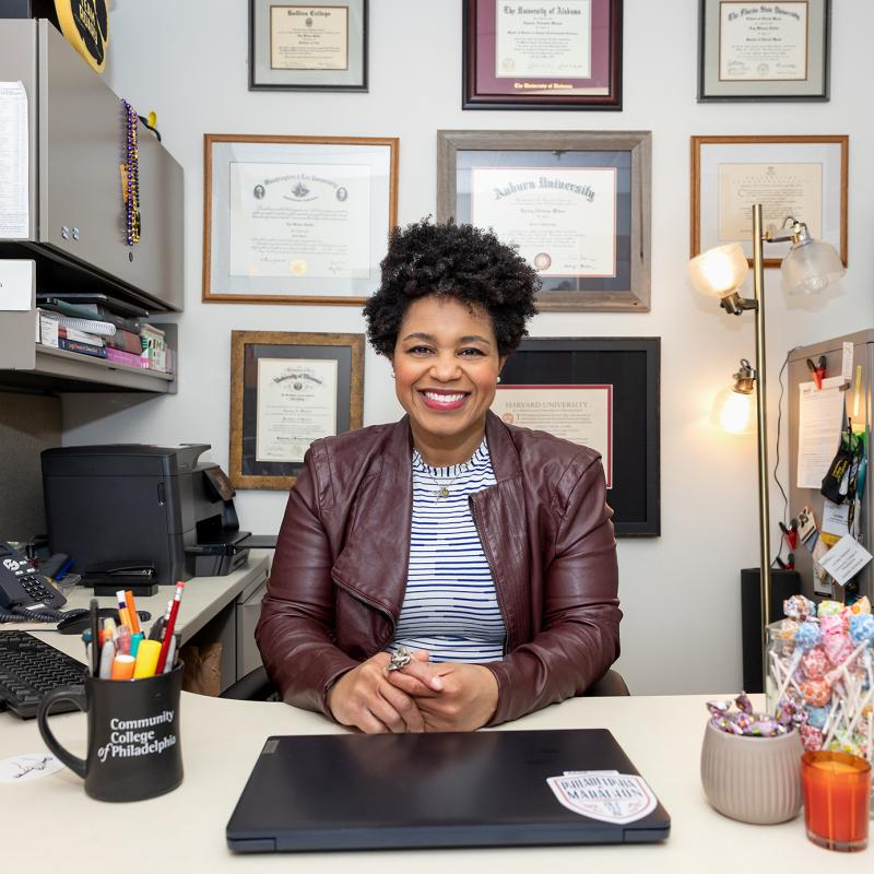 Employee smiling in her office