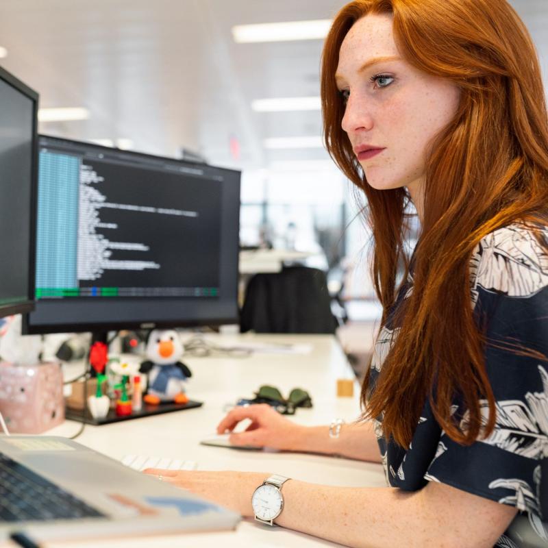Person coding at desk