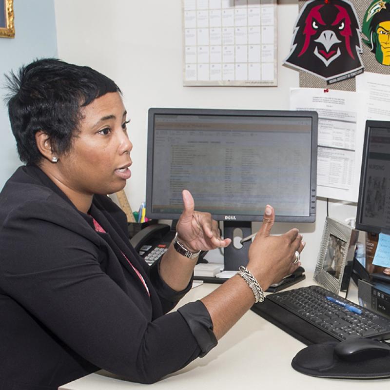 An advisor gives advice to a student.
