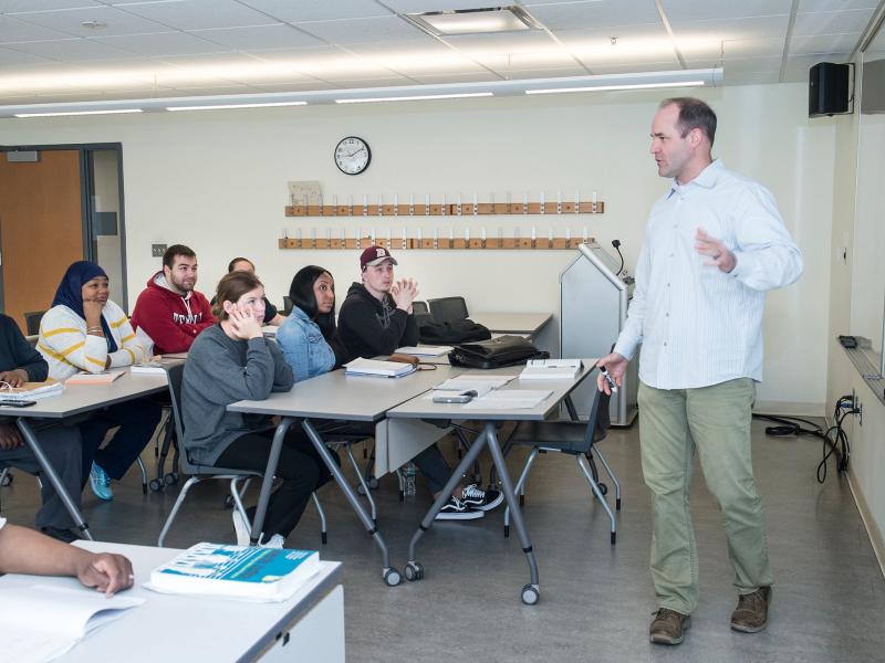 Teacher Lecturing in front of a classroom