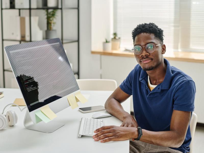 Person coding at their computer