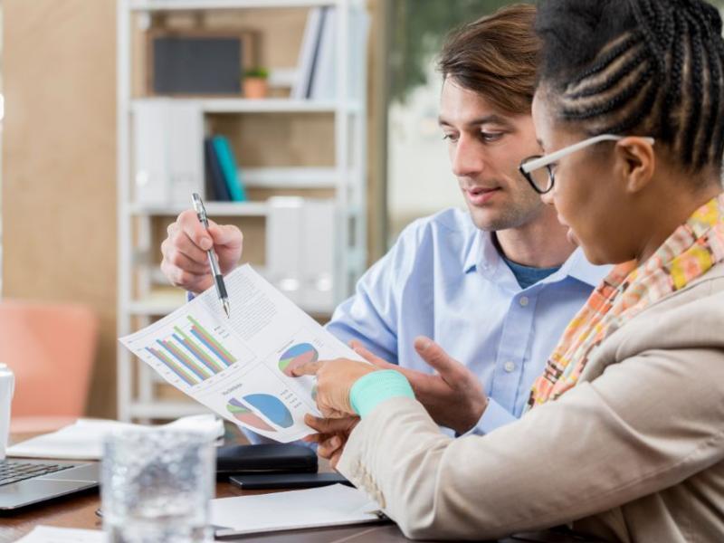 An accountant reviews financial information with her client