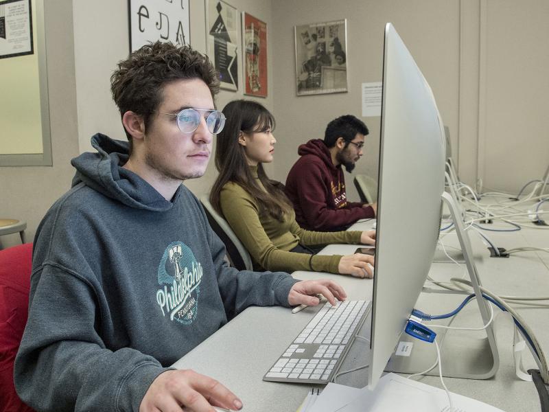 Student works at a computer screen