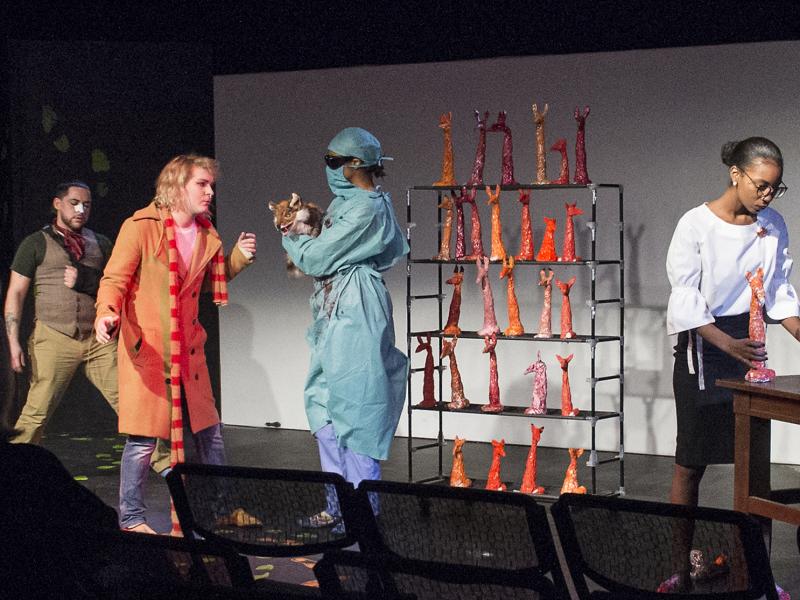 Actors on stage performing a play.