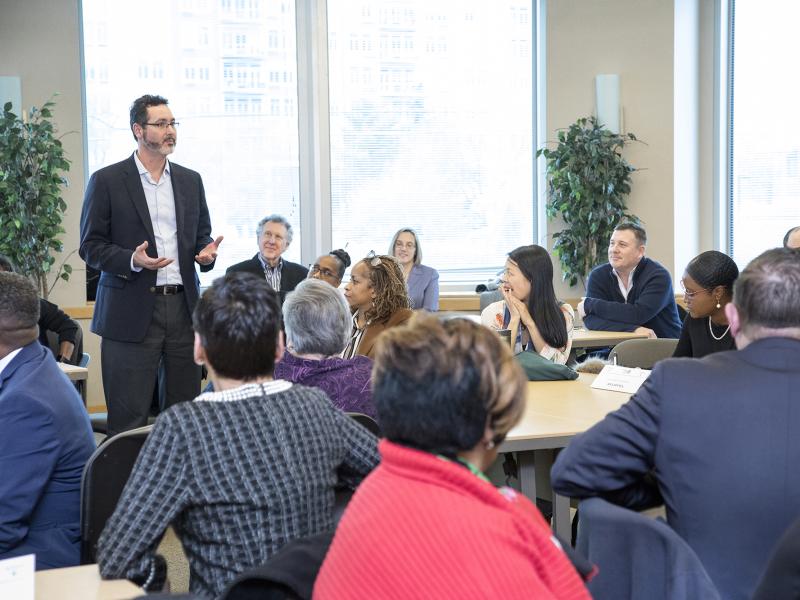 Businessman speaks to a room full of business owners.