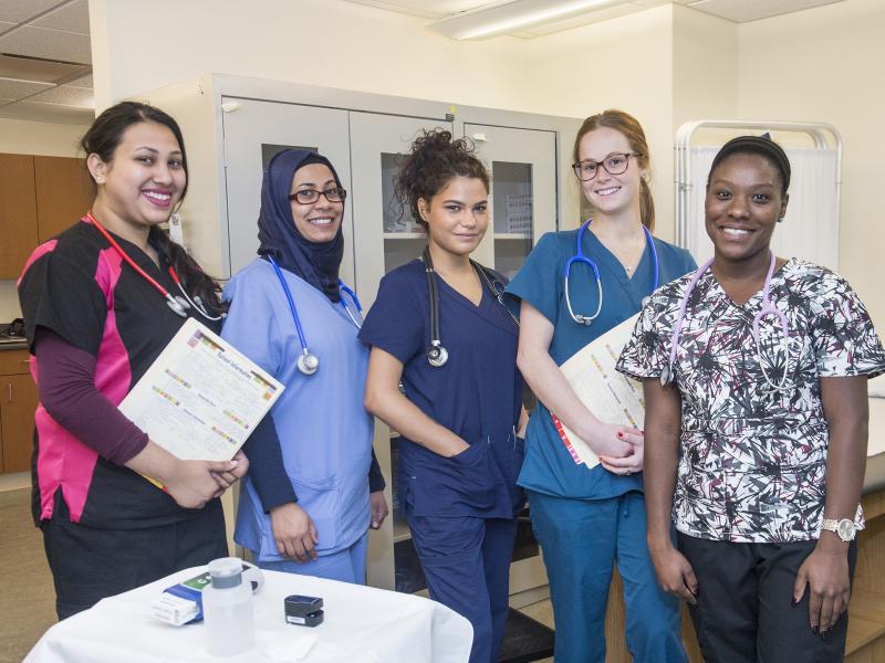 A group of health services students smiling.