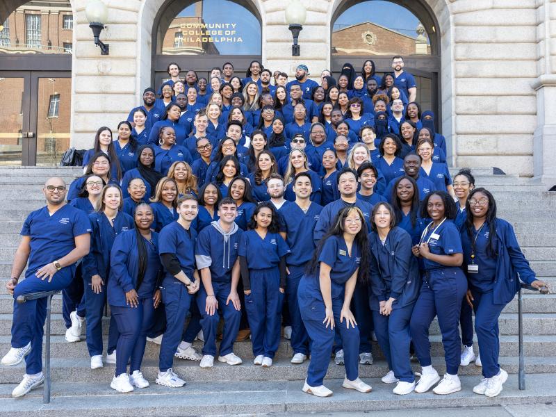 Nursing students standing on steps of the Mint Building
