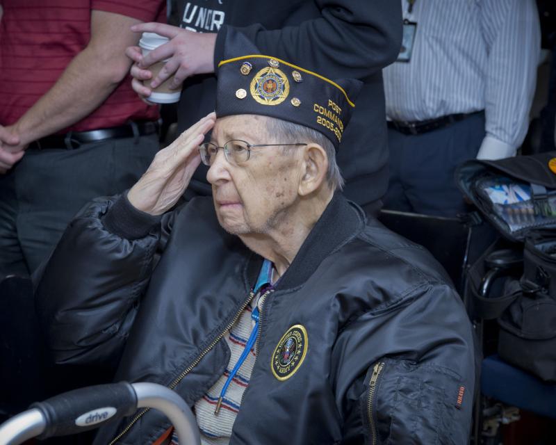 Older Veteran Saluting the flag