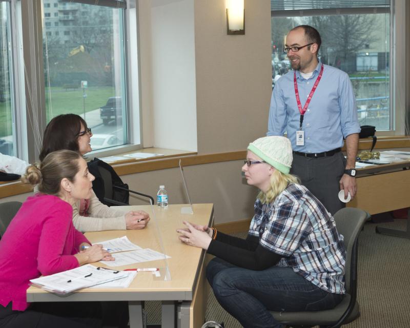 student talking to staff 