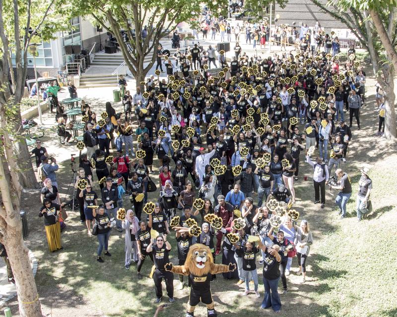 Students on campus gathered with roary