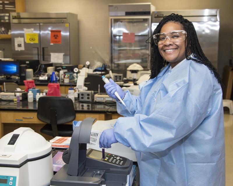 Student smiling in lab