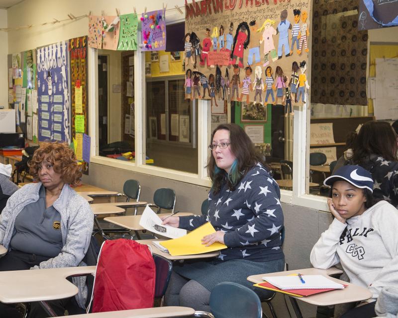 People sitting at desks in a classroom