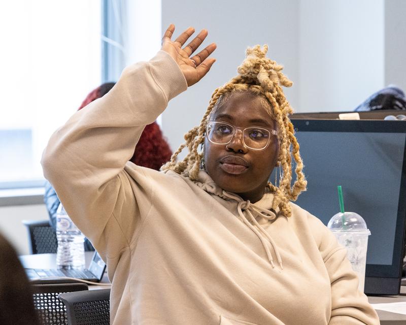 A student raises their hand
