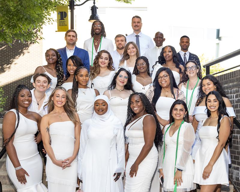 Nursing students standing on steps outside of pinning ceremony